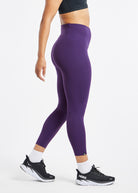 Essential Bird 3/4 length Running Tights in Twilight purple, side view